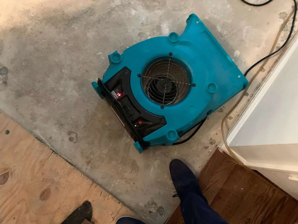 Air mover drying subfloor during Commercial Water Damage Restoration in Hot Springs Village